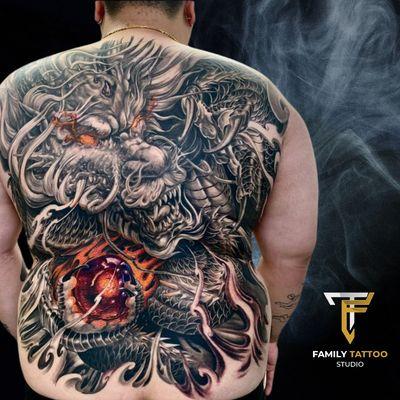 This dragon tattoo isn't just holding a gem, it's holding onto your dreams!