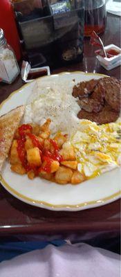 2 eggs over medium, home fries, grits, sausage and toast.....yum