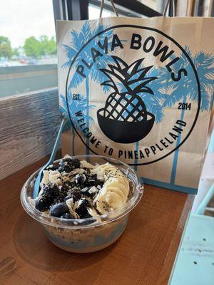 Olas bowl: Banana blend topped with granola, banana, blueberry, coconut flakes, chia seeds and almond butter