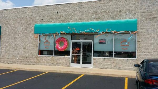 As you can see, we don't have a sign on our building yet, however we do have the big Pink Doughnut in the Window!