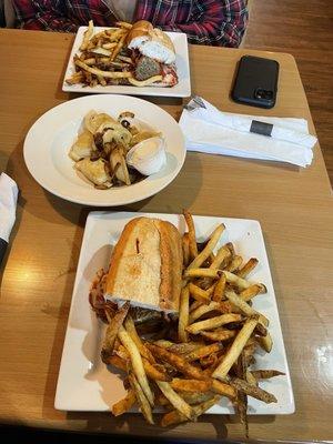 Meatball hoagie split in half and pierogis.