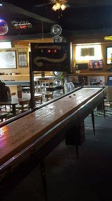 Full-sized shuffleboard table.