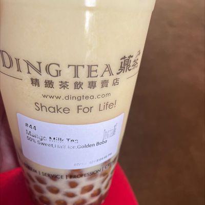 Mango milk tea with golden boba