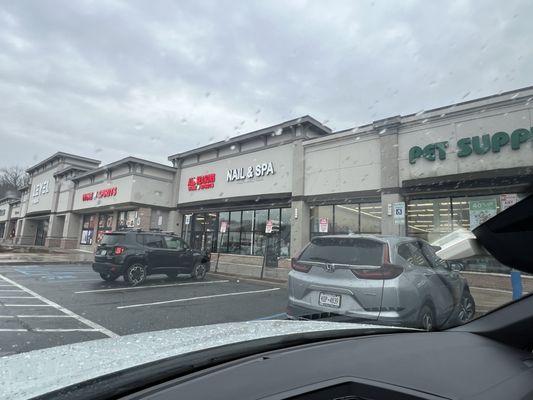 Nail salon located between wine & 
 pet store inside of bjs shopping center.