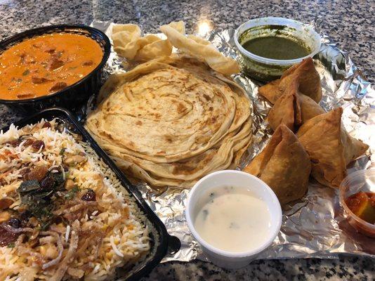 Biryani, chicken tikka masala, paratha and samosas