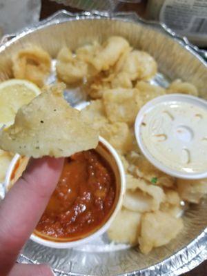 Deep fried condoms they tried passing as calamari. RUBBER.