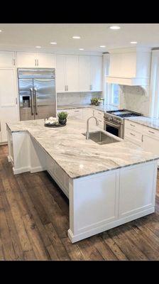 Kitchen remodel with a large island with sink .. excellent counter space to entertain and cook !