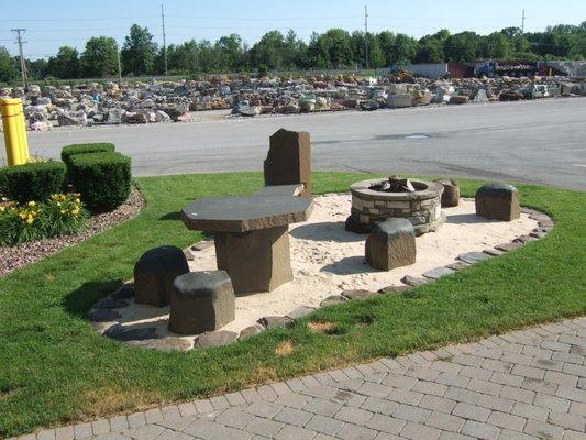 Natural Basalt Stone Seats and Table set in Beach Sand area