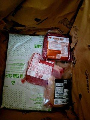 Meat is packed in the bottom of the box between reusable ice packs. Fresh even in Georgia heat!