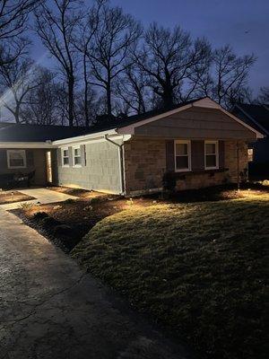 After photo a recent renovation.  New walkway, sod, lighting, paver patio and sitting wall.