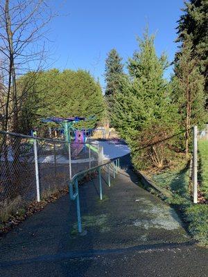 Ramp from upper field to playground below.