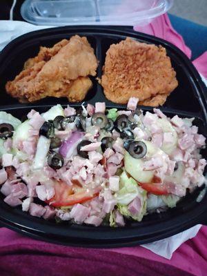 Salad, pork chops, fried chicken