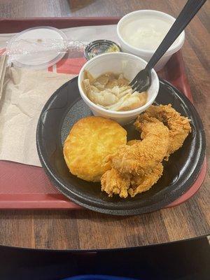 3 piece chicken finger dinner with coleslaw, mashed potatoes and a biscuits.