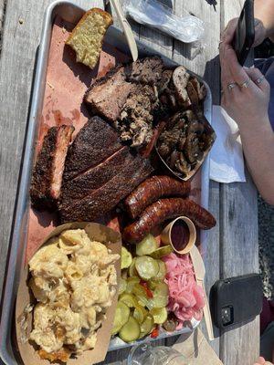 Ribs brisket smoked sausage smoked chicken thighs pulled pork smoked mushrooms homemade bread & butter pickles Mac n cheese