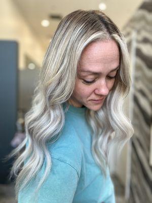 We gave her hair extensions for volume and length! As well as lived blonde highlights for lower hair color maintenance.