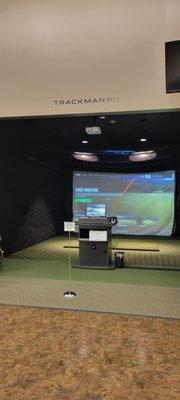 Practice bay with golf simulators