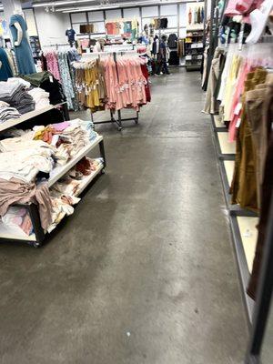 Aside From A Bit Of Unfolded Clothing, Aisles Are Clean.