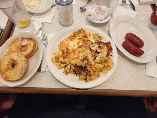 Lox omelette with home fries , toasted bagel and side of sausage