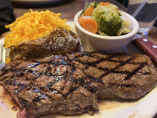 Ribeye with baked potato and mixed veggies