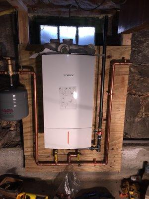 Combination boiler and on demand hot water installation