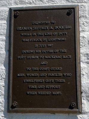 Plaque by the lighthouse door.