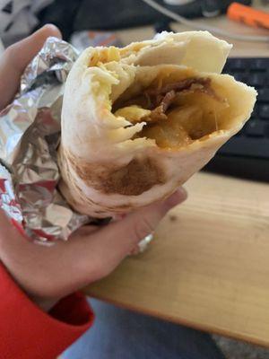 Big Breakfast Burrito with bacon and Christmas chile. Long and skinny but good.