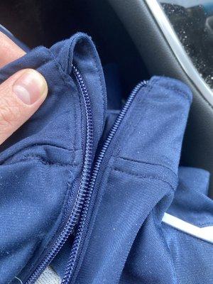 Zipper of blue jacket matches color and original connection points