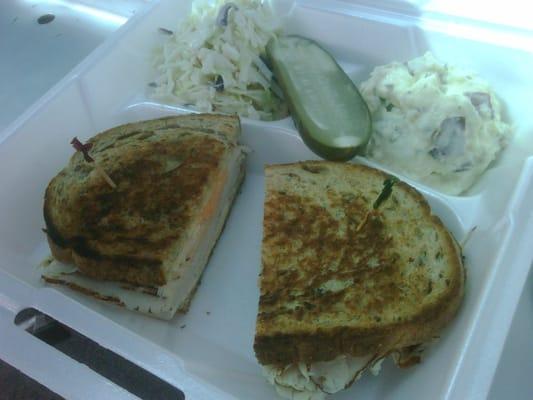 Turkey Melt w/ Russian Dressing (get the dressing).  All of this (sandwich, slaw and potato salad) plus a can of soda for $6.00