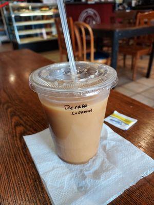 Iced decaf coffee with coconut milk.