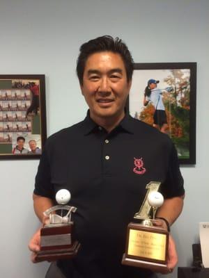 Dr. Peng in the golf corner with Jack, his 2 hole in one's and collegiate golf daughter