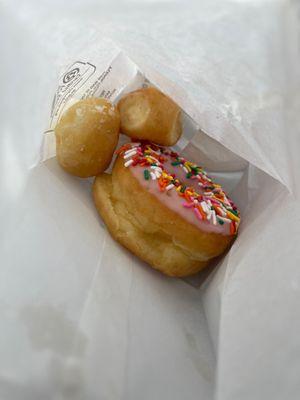 Strawberry iced donut with sprinkles! (And some bonus munchkins!)