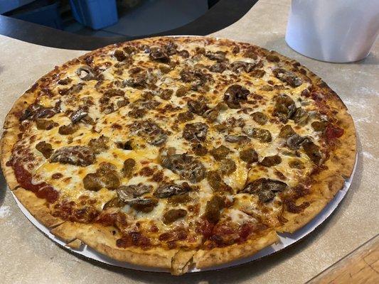 Dairyland pizza thin crust with sausage and mushroom.