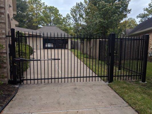 6ft tall plain drive way gate with plastic finials. 
LA400 LIFTMASTER  Gate operator.