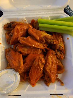 Takeout hot wings with curly fry nest