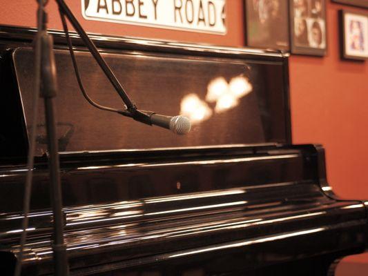 Upright piano in our venue frequently used for open mic performances. 
PC: Jay Connor @heymynamesblue