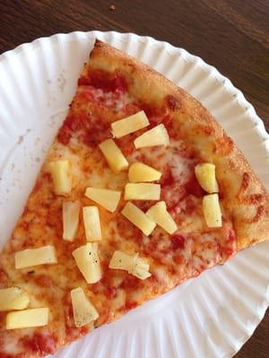 Perfect cheese and pineapple NY style pizza.