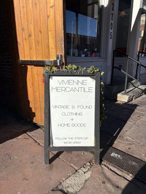 Sign outside the building on Larimer Street.