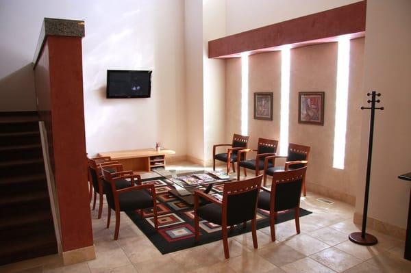 Comfortable reception area with kids area and TV