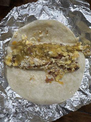 Bacon and egg taco with green salsa