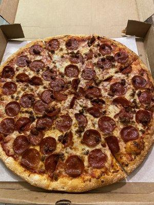 Large pepperoni and sausage pizza.