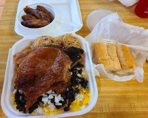 Cuban roast pork, black beans and yellow rice, pigskin, and fried plantains. With Cuban bread!