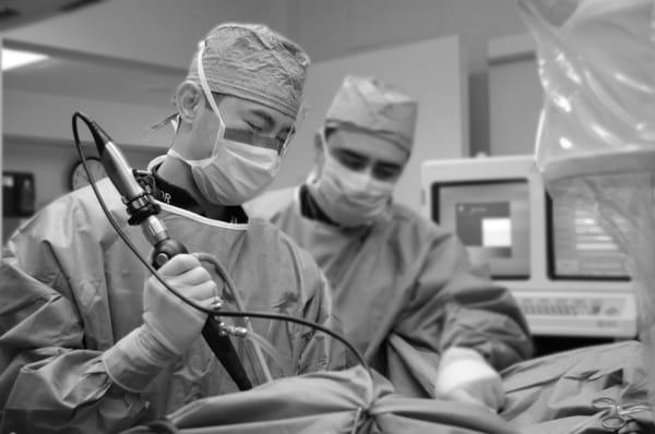 Dr. Louie in the operating room with a ureteroscope.