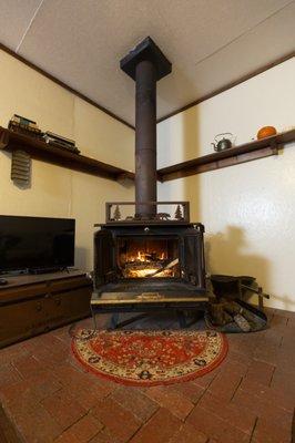 Cozy fire in the woodburning stove of the Magnolia