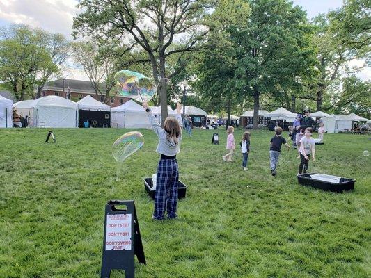 Kids blowing huge bubbles