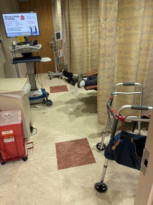 This is the room with 3 patients in recliners and 6 visitors