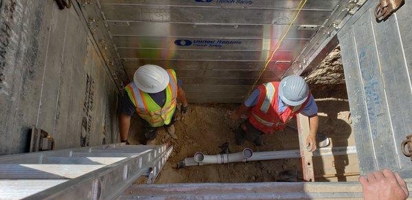 Excavation crew being safe with our shoring in place for this deep dig.