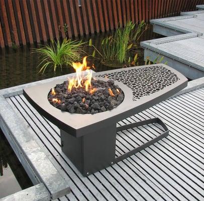 The Eeva fire table.  Steel with temperature resistant finish. 2' x 4' x 20"h. Propane tank housed in base.