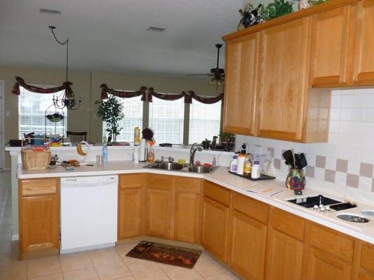 The homeowner had builder grade oak faced cabinets.  The cabinet ends were veneers and over time did not age to the same colo...