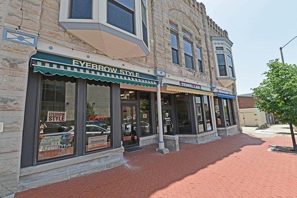 Eyebrow Style is located inside Fountain Square just off of S. College Avenue on Bloomington's downtown square.