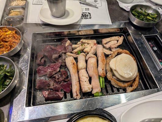 Gopchang Grilled Menu B Set. $69.99 for 3-4 people. Beef heart (L), first intestine (top), large intestine (bottom), small intestine (R).